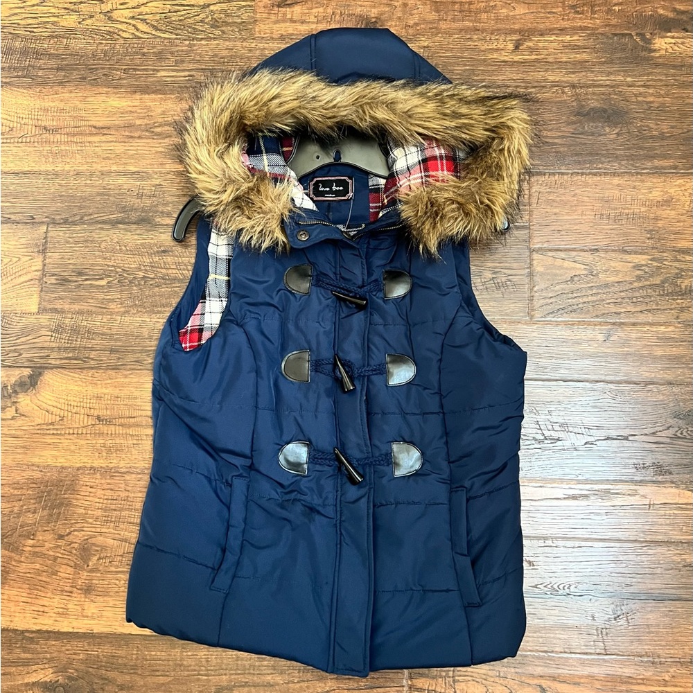 Navy Blue toggle Puffer Vest with faux fur hood lining, sized medium.